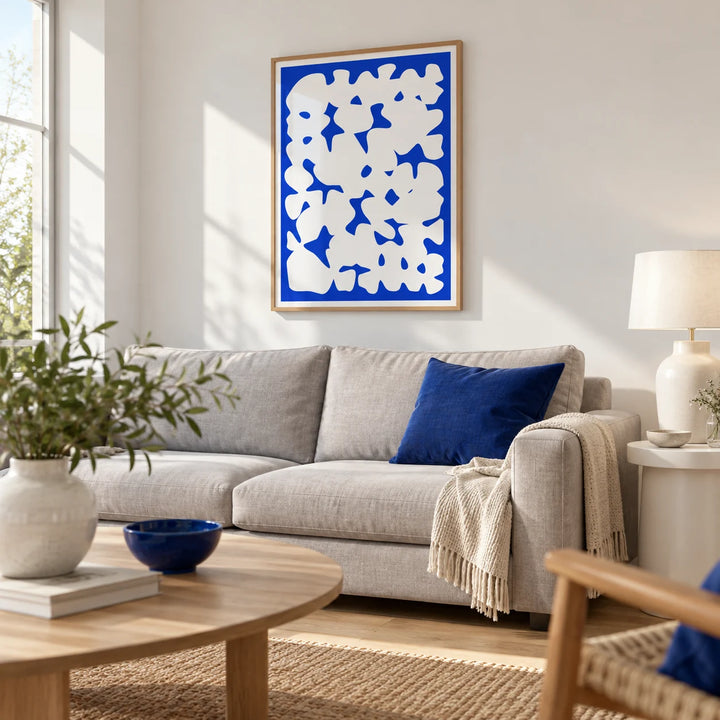 Blue And White Modern Art, framed on the wall of a bright modern living room