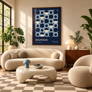 Blue Circles Wall Art, framed on the wall of a mid-century living room with a curved cream sofa