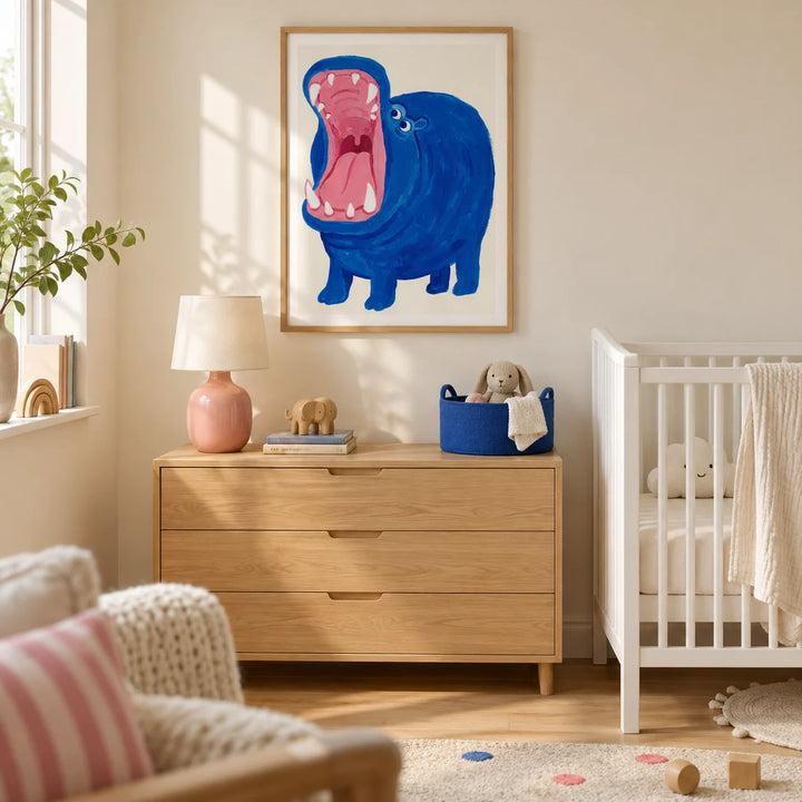 Blue Hippo Art Print, framed on the wall of a cheerful modern nursery in a UK family home with warm cream walls and a pale oak floor