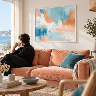 Blue Pink Abstract Painting, framed on the wall of a bright seaside flat living room with a white wall