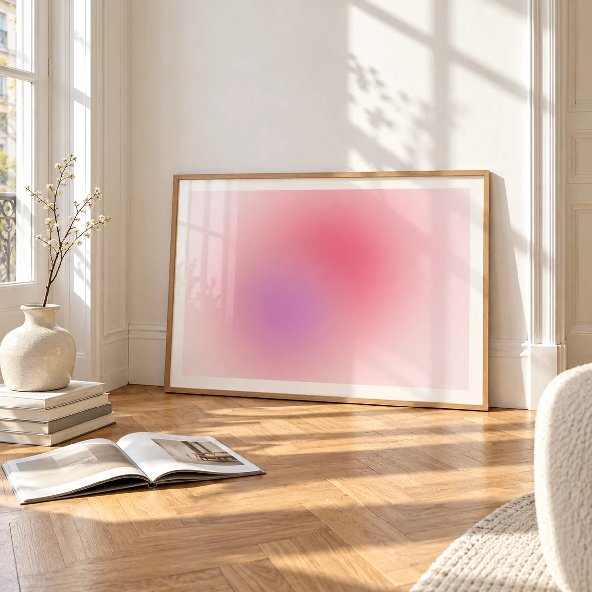 Blush Wall Art, framed and leaning on the parquet floor of a bright living room