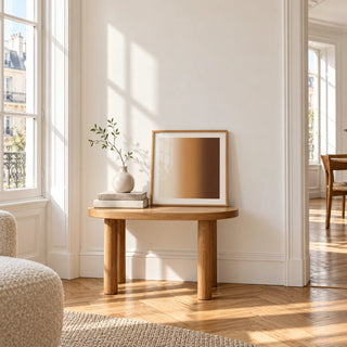 Brown Wall Art, a small square framed print leaning on a small solid oak side table