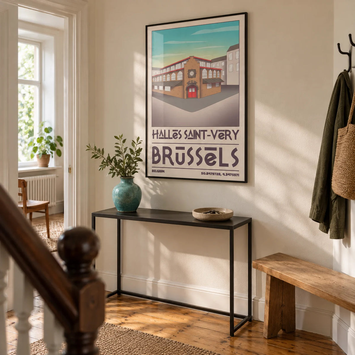 Brussels Architecture Art Print, framed on the wall of a welcoming hallway in a renovated Victorian terrace with pale cream plaster walls and original timber floorboards