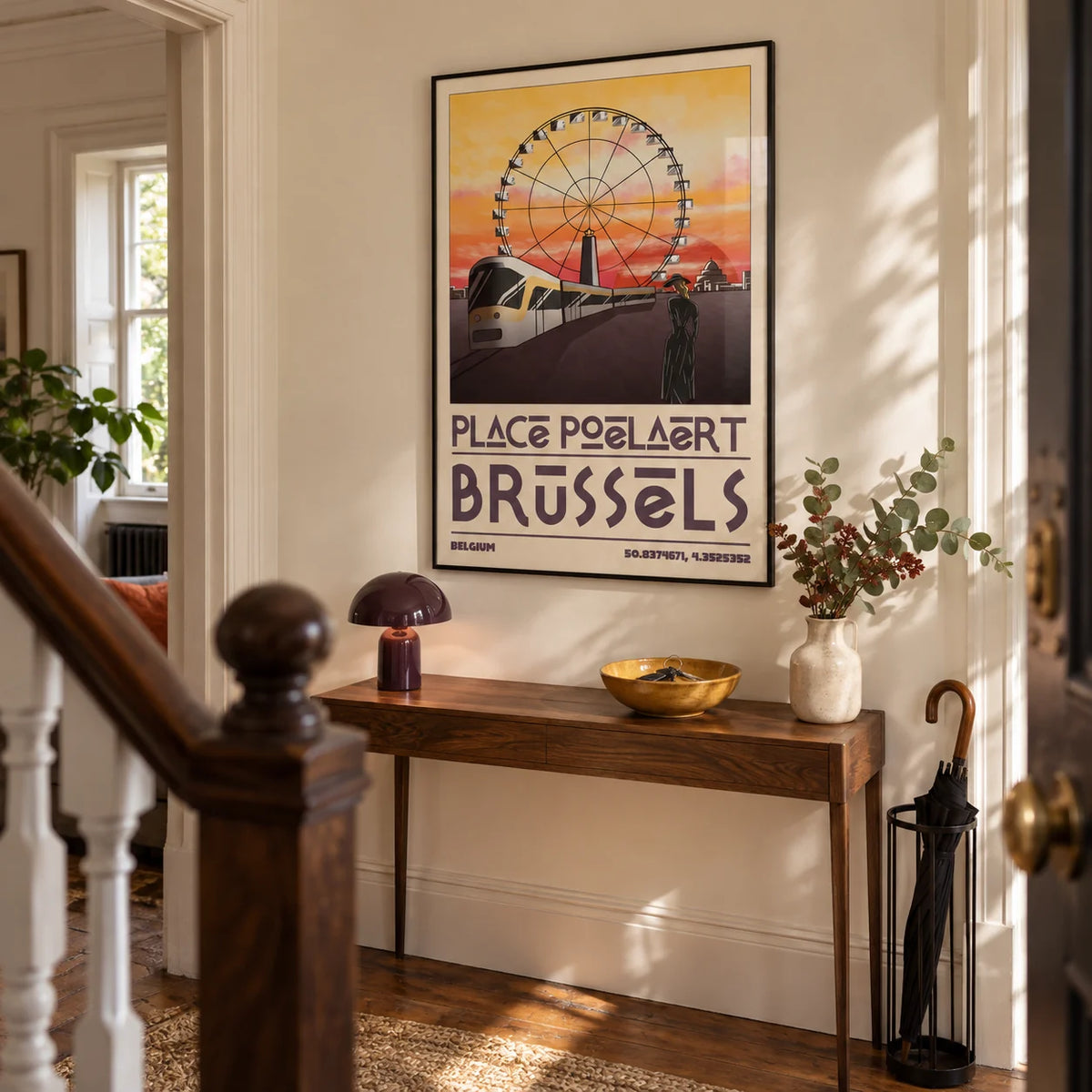 Brussels Cityscape Art Print, framed on the wall of a welcoming hallway in a Victorian terrace with pale cream plaster walls and warm brown timber flooring