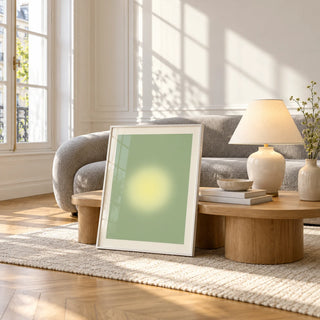 Butter Yellow Wall Art, framed and leaning against a coffee table in a bright living room