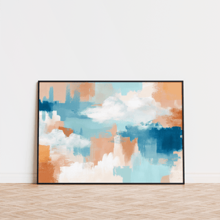 Abstract Cloud Print leaning black framed print with blue and orange tones on wooden floor