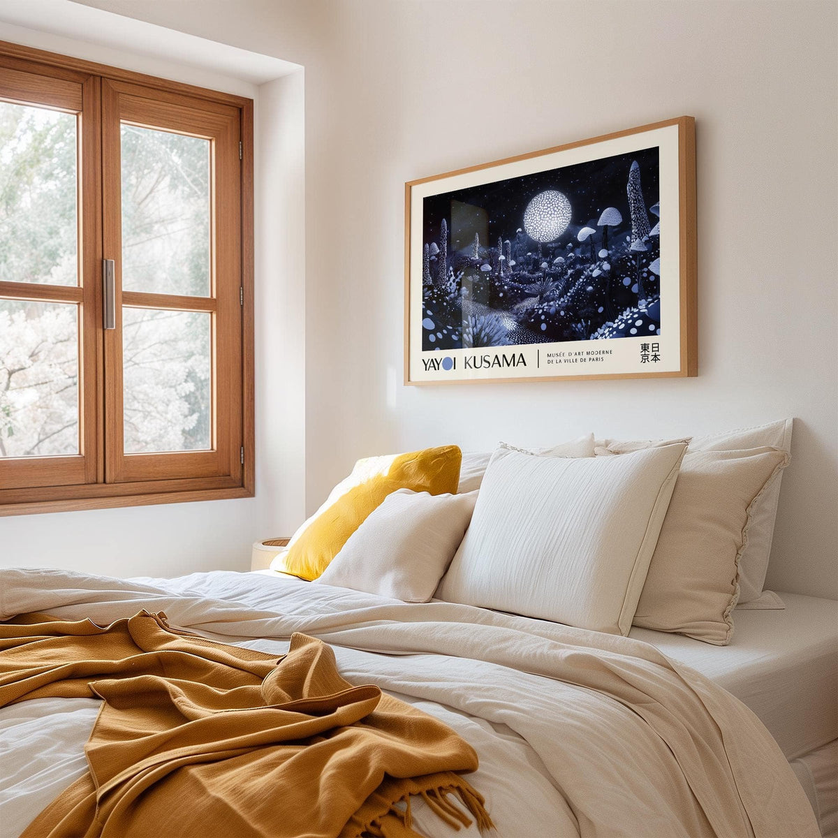 Moon Art Wall showing luminous fungi illustration with dark blue and white tones above a bed with white bedding and a mustard throw