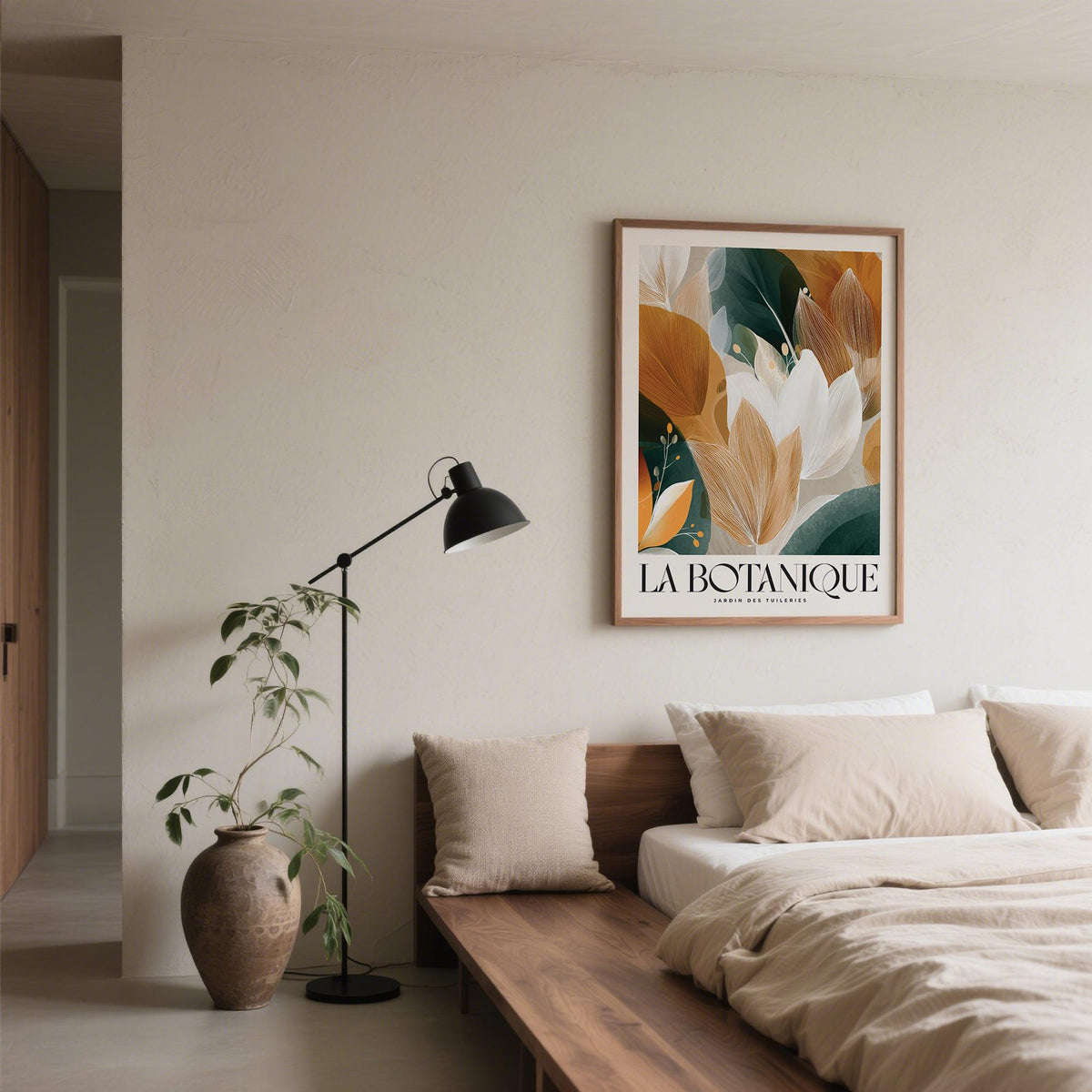 Wall Art with Leaves framed print showing abstract botanical foliage in earth tones above a wooden bed with beige cushions
