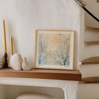 Minimalist Poster Art leaning on a wooden mantel with abstract branches and golden dots next to candles