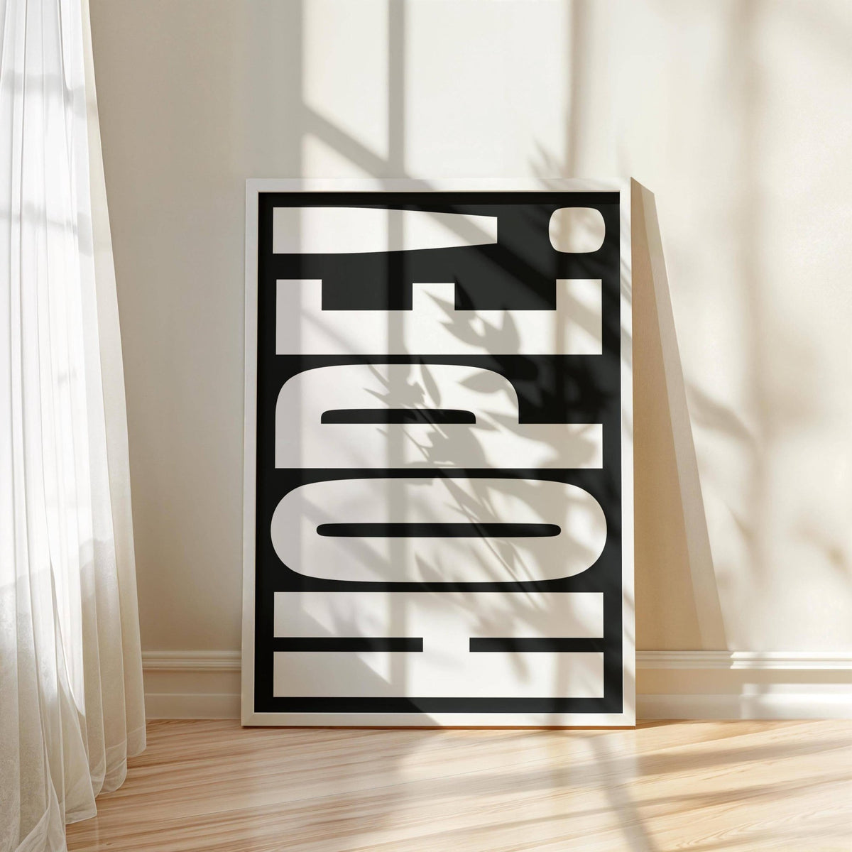 Inspirational Artwork print leaning on a wooden floor with sunlight and curtain shadows