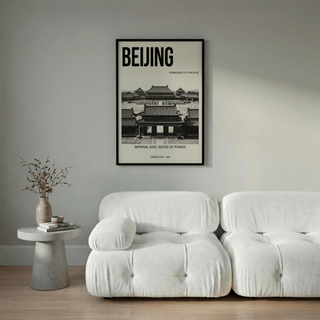 Beijing Architecture Art Print of forbidden city gates in black and white over a white sofa and grey wall with a side table