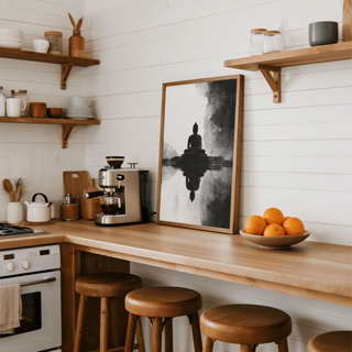 Meditation Art Print leaning on a kitchen counter beside a coffee maker and a bowl of oranges