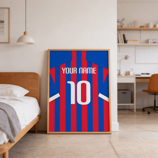 Print leaning on the floor of a bedroom showing a blue and red striped football shirt with number 10 and text
