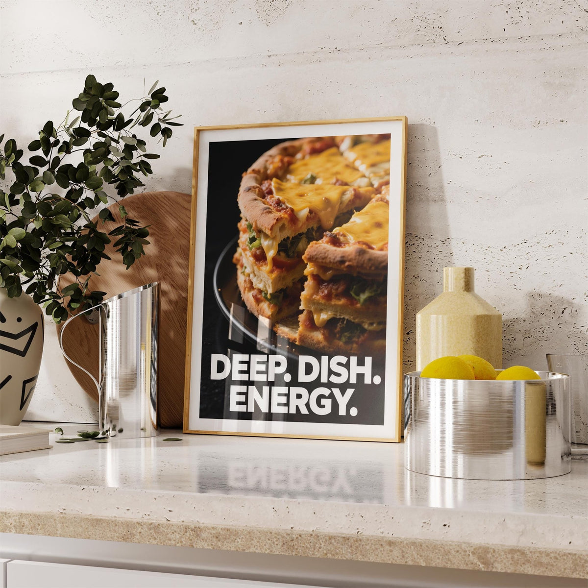 Framed Foodie Gift Idea print of a deep dish pizza slice with yellow cheese on a kitchen counter near lemons