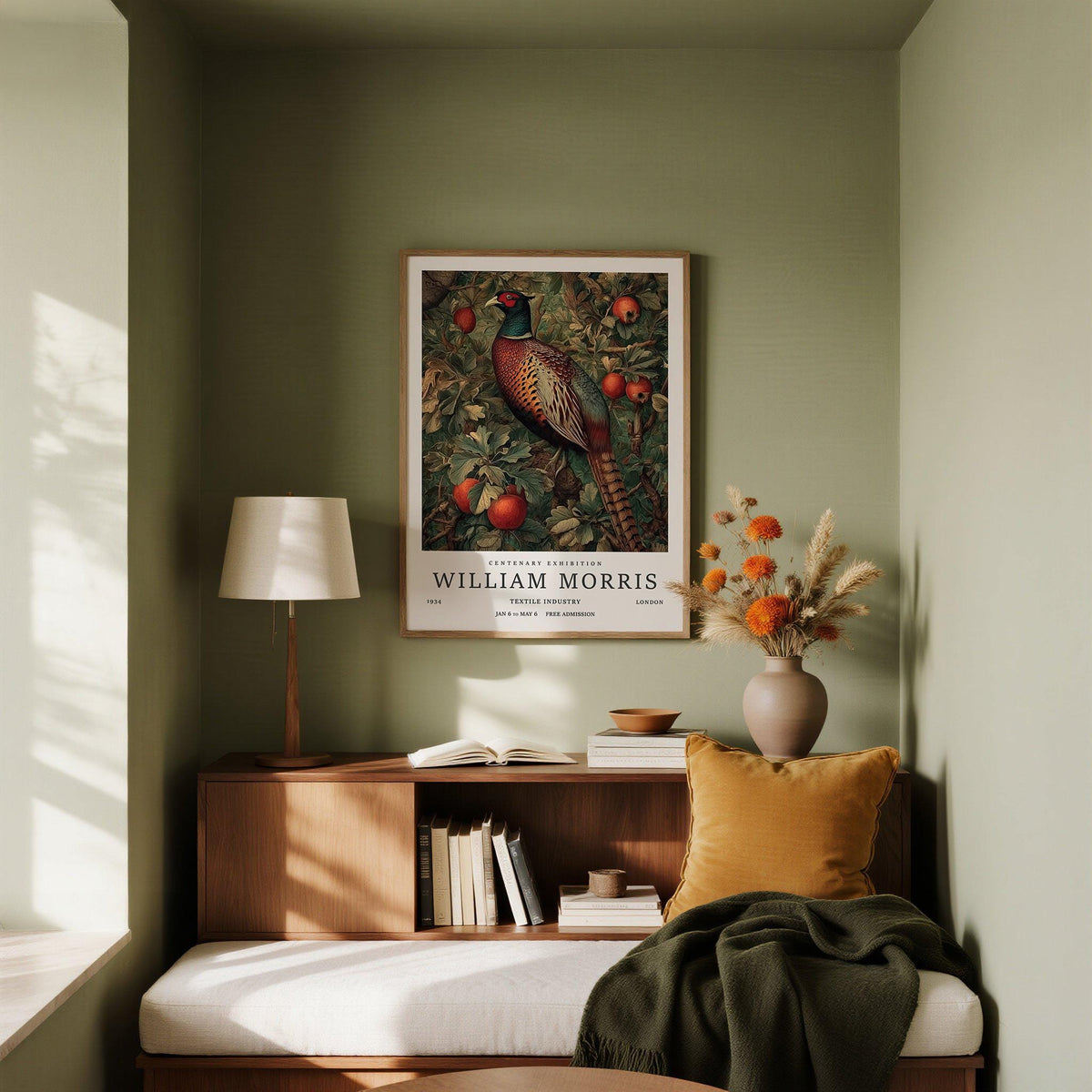 Pheasant wall art with vintage botanical illustration hung above a wooden sideboard with books and dried flowers