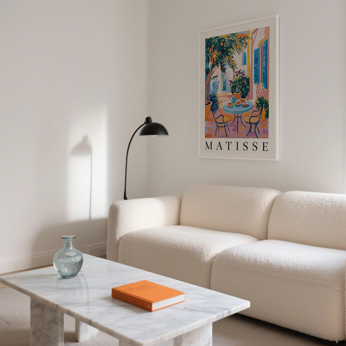 Wall Art Mediterranean mid-century illustration of citrus tree patio scene above a white sofa with a floor lamp