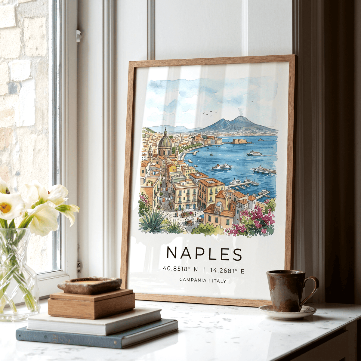 Naples City Art Print leaning on a windowsill with books and a cup visible