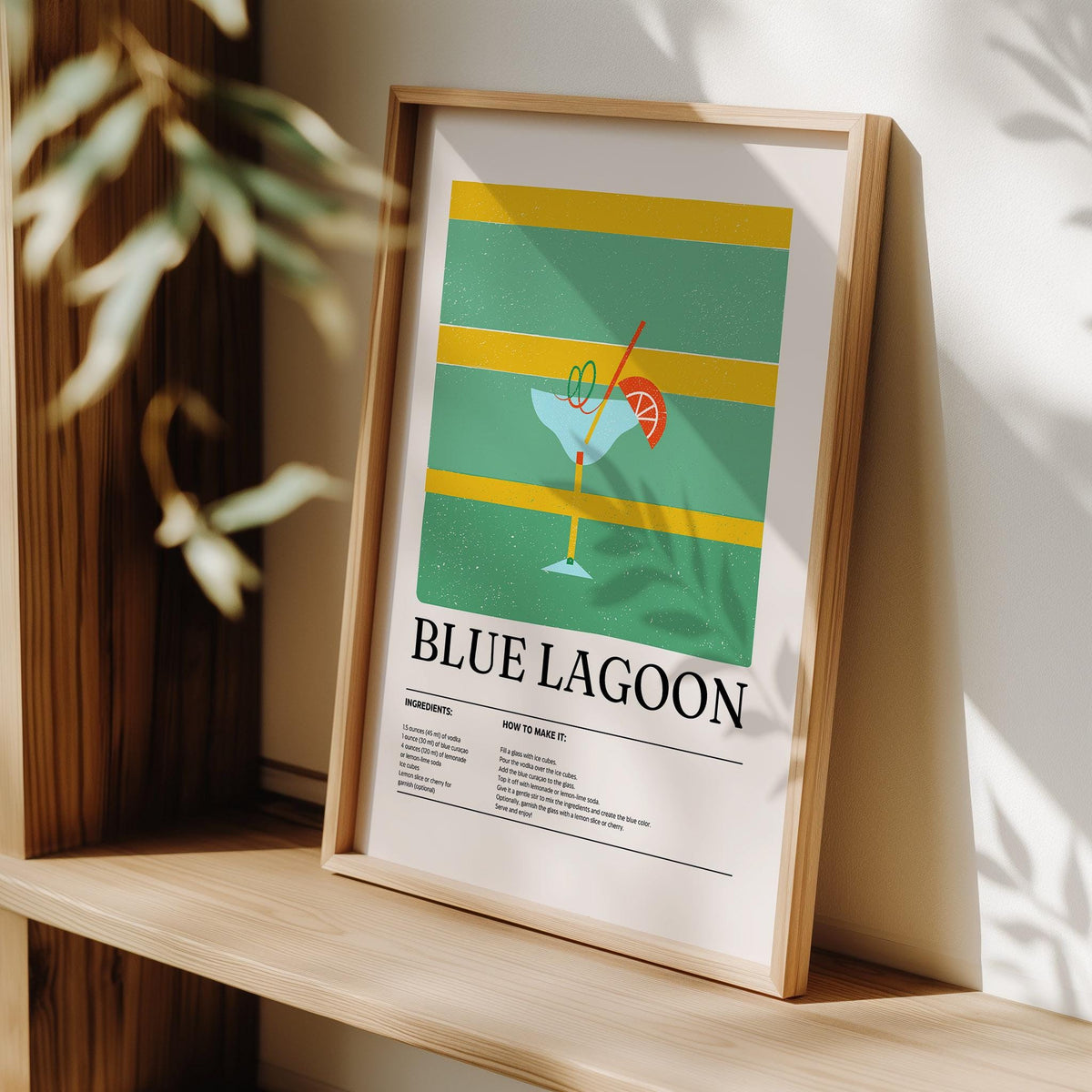 Framed Citrus Lagoon print leaning on wooden shelf with shadows and blurred plant nearby
