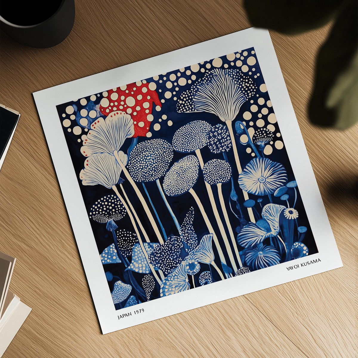 Red and Blue Art showing abstract mushroom shapes in blue and red on a wooden table