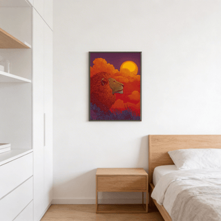 Print on a wall in a bedroom showing lion sunset art print with a red lion profile and orange sun above a wooden bedside table