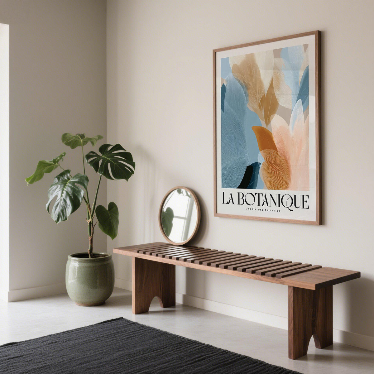 Blue Pink wall art of abstract botanical leaves in blue and peach tones above a wooden bench with a mirror