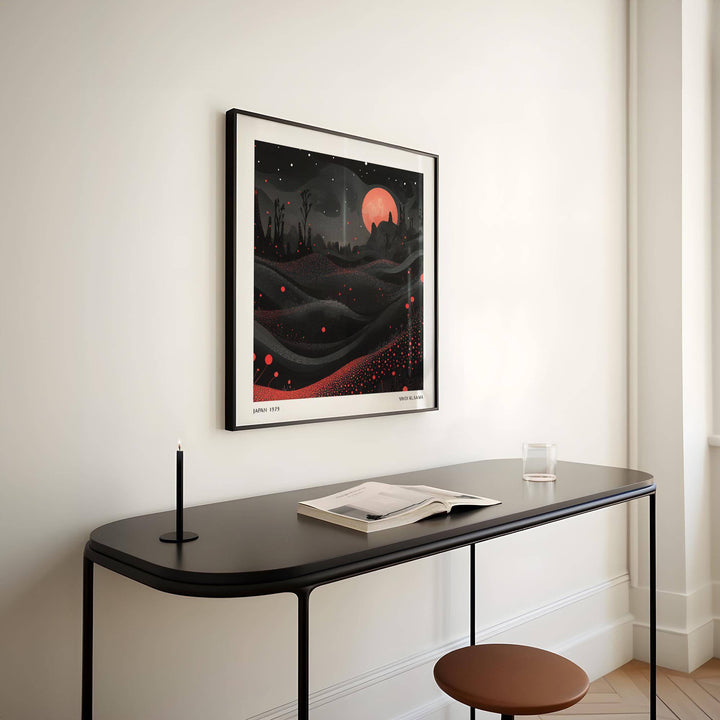 Wall Moon Art red moon landscape with black and red abstract hills above a black console table with book