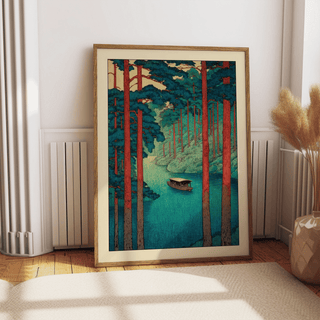 Close-up of river landscape print showing pine trees, layered hills, and woodblock-style texture
