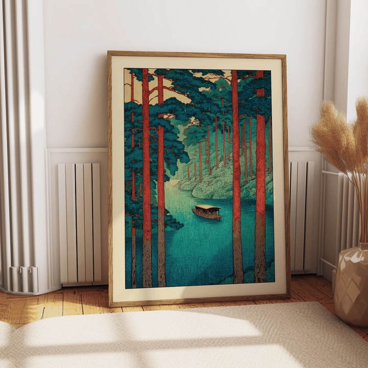 Close-up of river landscape print showing pine trees, layered hills, and woodblock-style texture