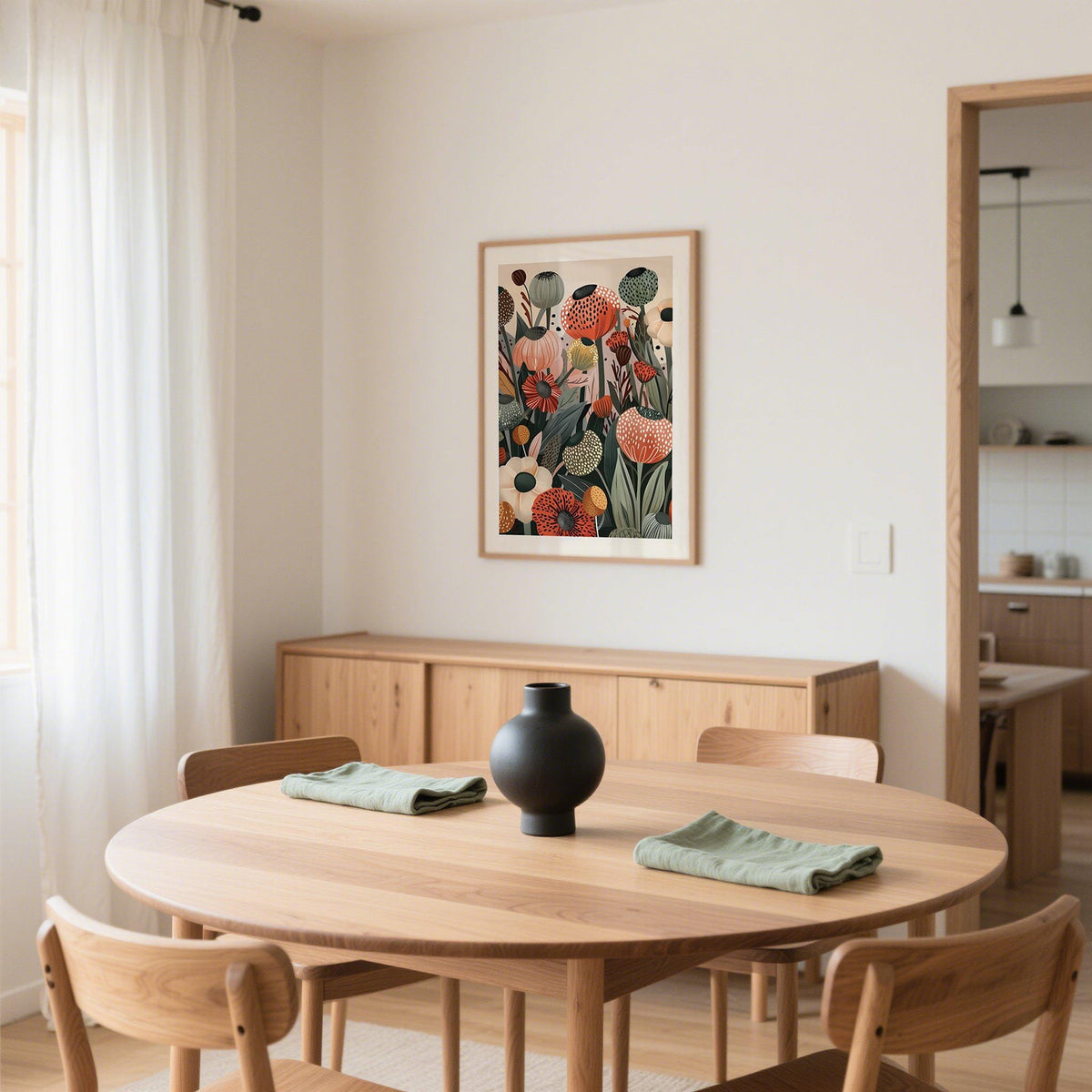 Floral print wall art with poppy seed heads in warm muted tones above a wood sideboard in a dining room