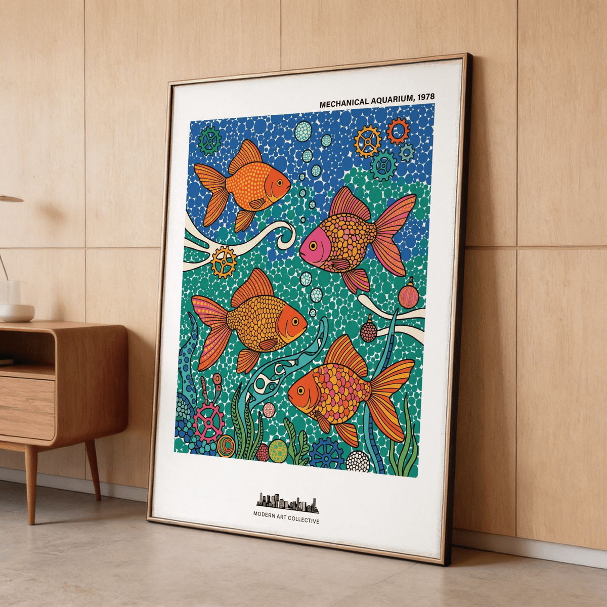 Fish poster leaning against a wooden wall with blue green and orange goldfish illustration