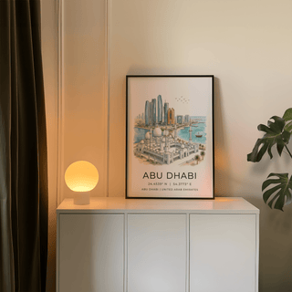 Abu Dhabi Art Print leaning on a white sideboard with a lit spherical lamp indoors
