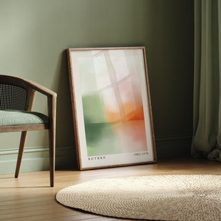 Peaceful wall art leaning on a wooden floor with green and orange abstract sunset tones near a green chair