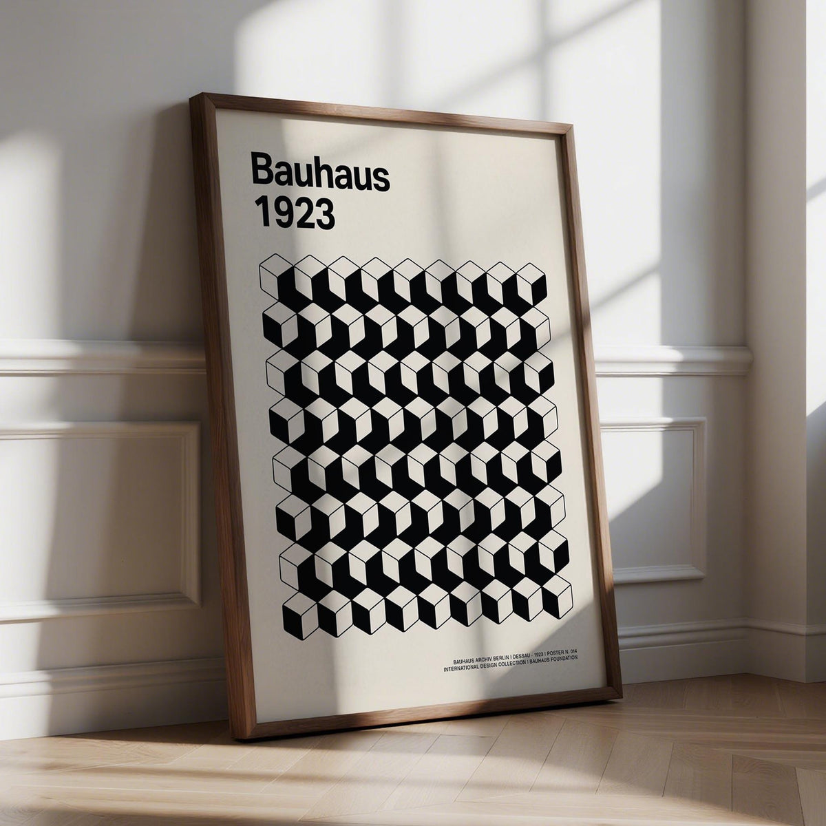 Print leaning with Bauhaus Design black and white cube pattern and text in sunlight