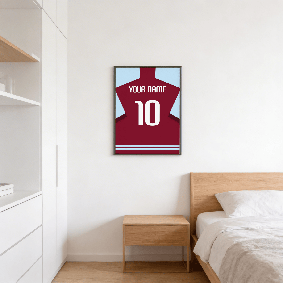 Football Shirt Poster in Plain Claret with White Number hanging above a wooden bedside table in a bedroom