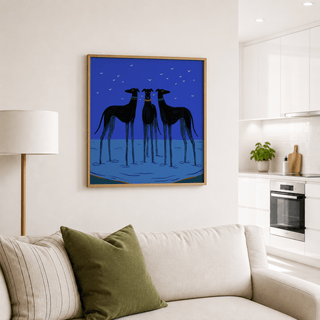Modern Dog wall art illustration of three black greyhounds on a blue background above a sofa with cushions
