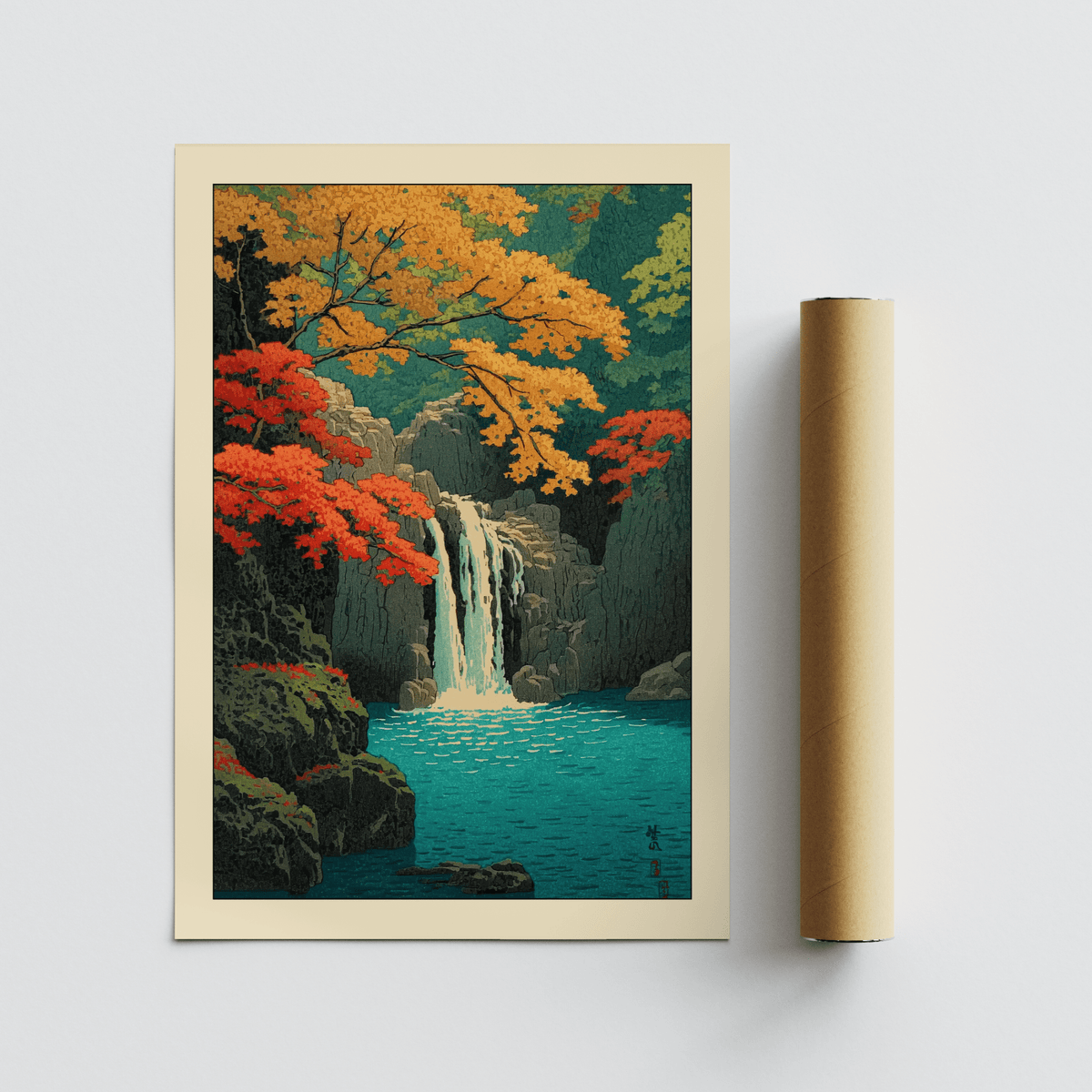 Hasui Kawase waterfall print leaning on a surface with autumn leaves in red and orange