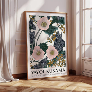 Pink wall art for bedroom with pink flowers and berries print leaning against a white wall