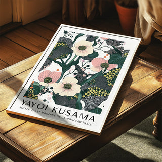 Print leaning on a wooden surface of poppy flowers illustration with green and pink details
