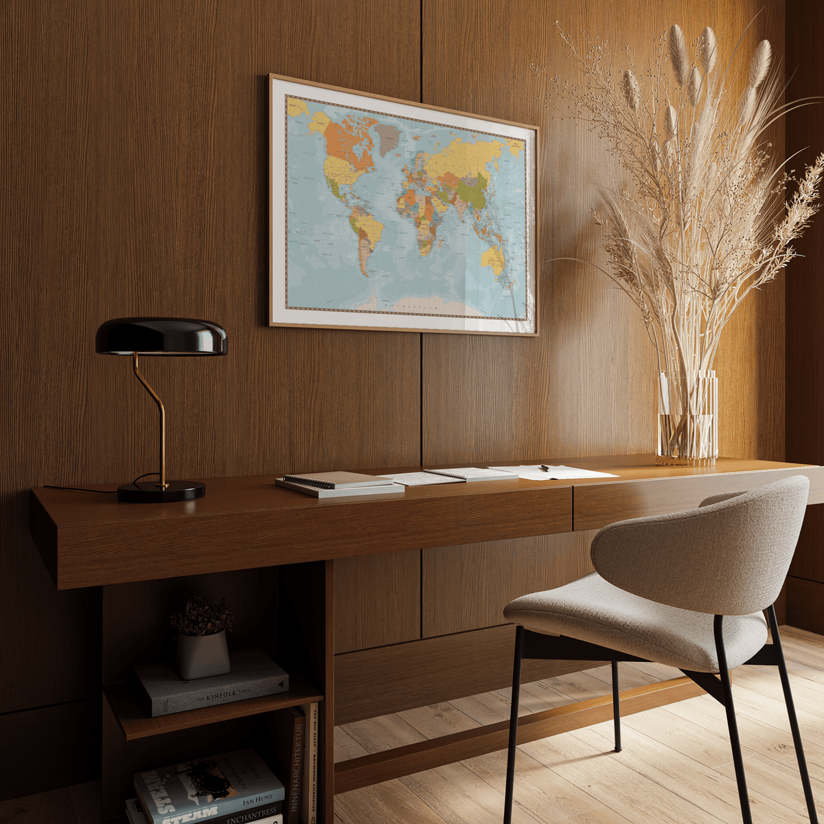 World Map Print on a wooden-paneled wall above a desk with a black lamp and chair in a study
