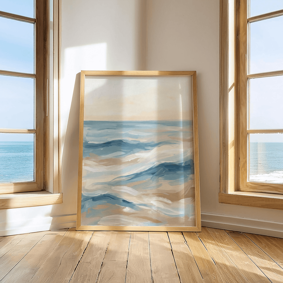 Ocean Wave Art Print leaning against a wall with natural wood frame by two windows showing the sea outside