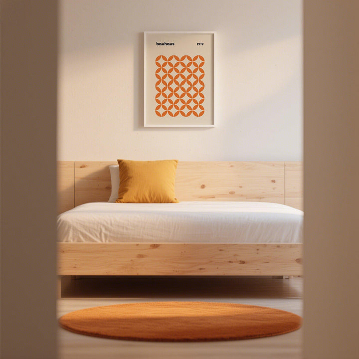 Orange Minimalist Print in a bedroom with a wooden bed, orange cushion and round orange rug