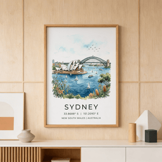 Framed Sydney Watercolor Art Print with blue water and harbour landmarks on a wooden wall