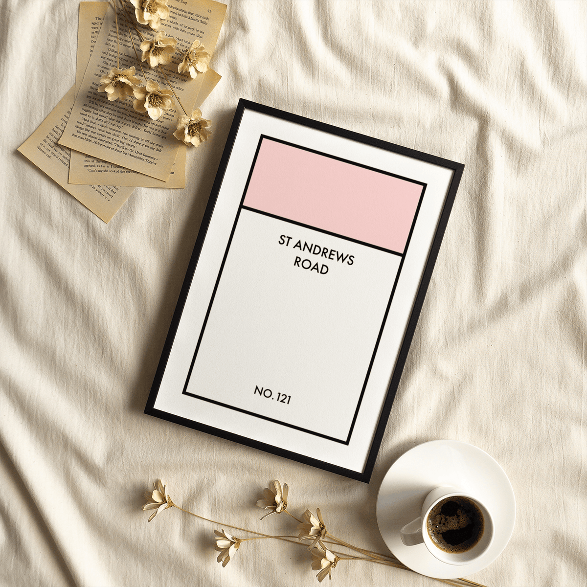 Framed Street Name Family Personal print with pink and white blocks beside a coffee cup and dried flowers
