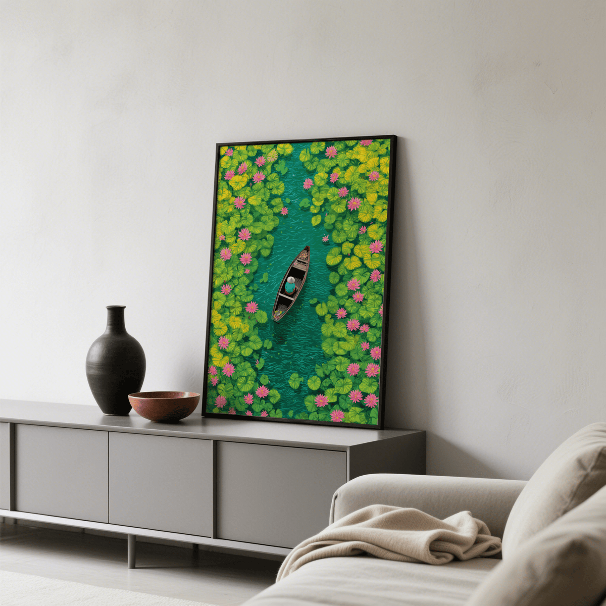 Colorful Water Lily Poster print leaning on a sideboard with a black vase and bowl nearby