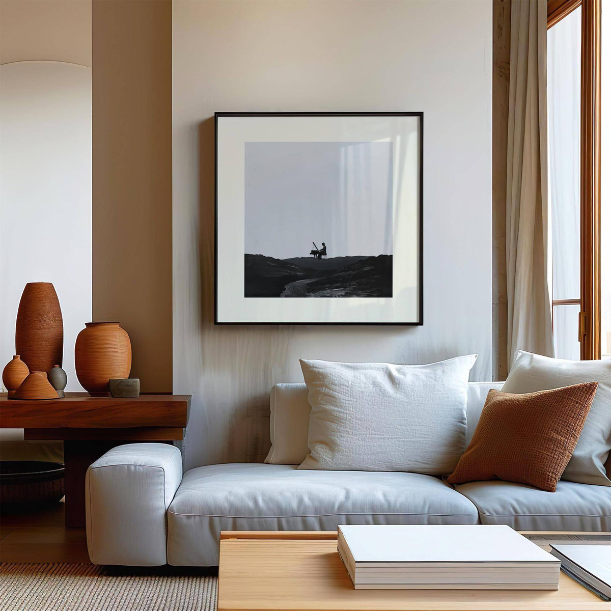 Piano Abstract Art print of silhouette playing piano in black and grey above sofa with cushions