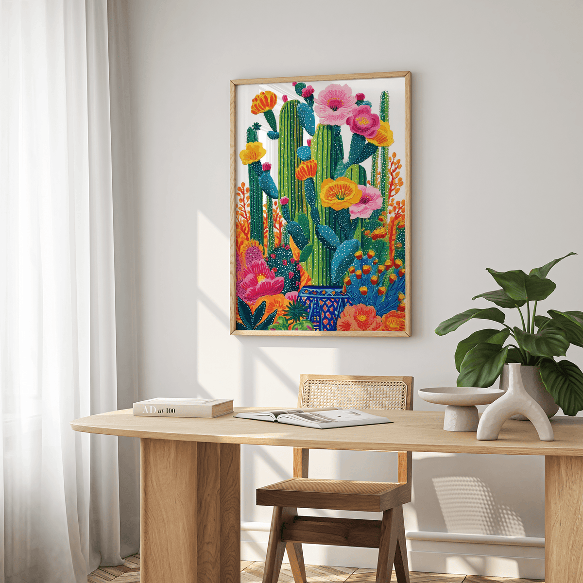 Cactus Floral wall art with colourful flowering cactus above a wooden table in a dining room
