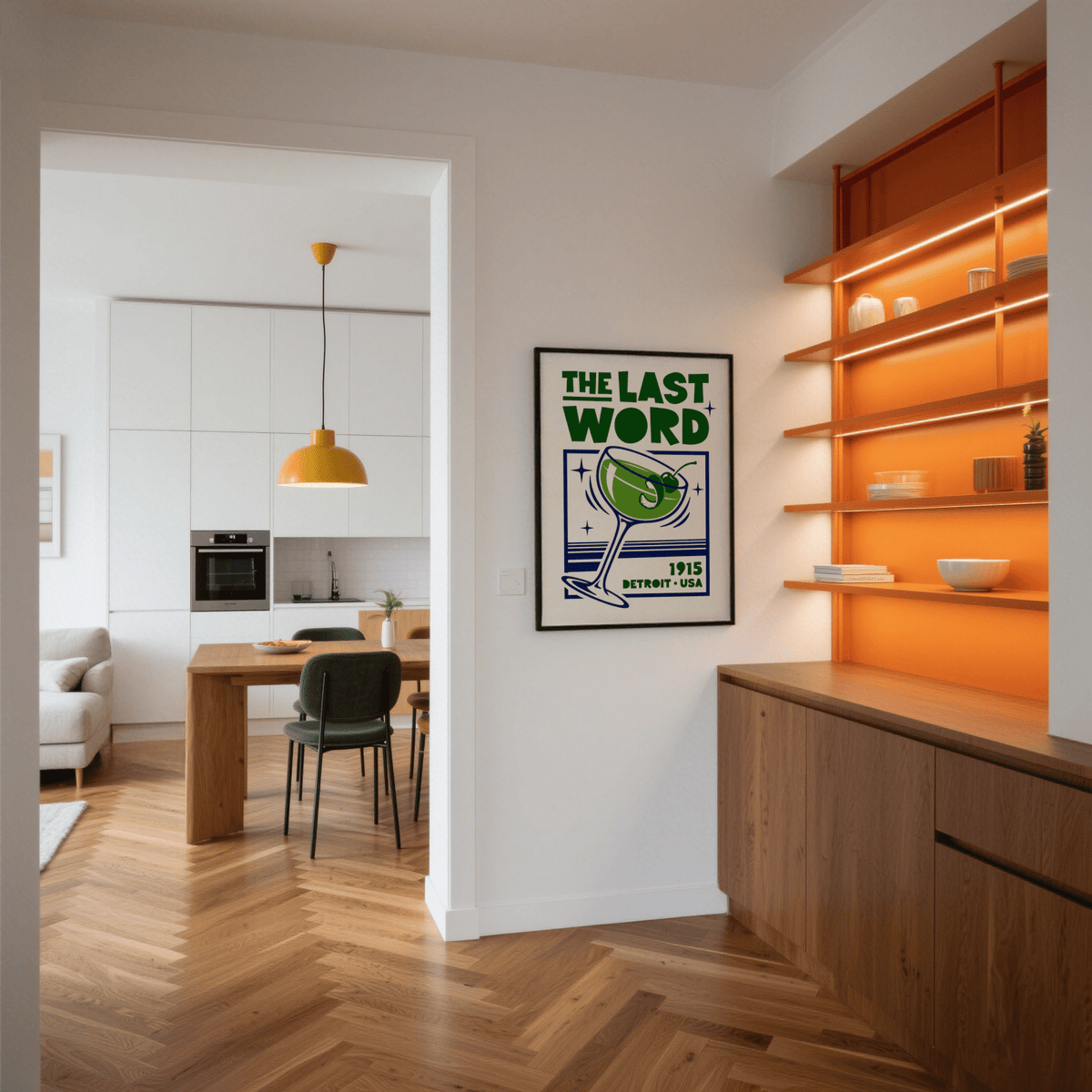 Cocktail art print of a green Last Word cocktail framed on a white wall near wooden shelves with orange lighting