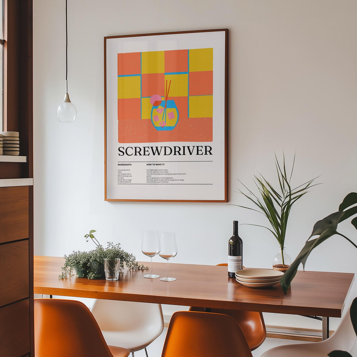 Art Prints Kitchen with screwdriver cocktail illustration print in wood frame above dining table with plant