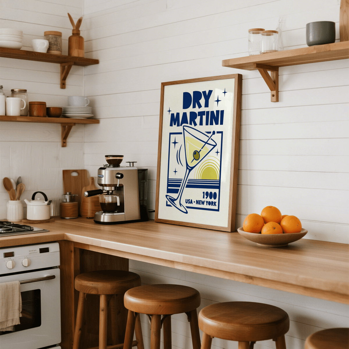 Dry Martini Poster print leaning on kitchen worktop near coffee machine and bowl of oranges