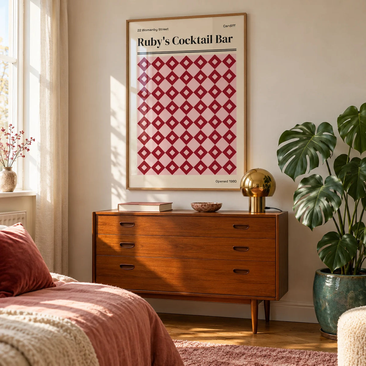 Cardiff Print, framed on the wall of a bright bedroom corner with a pale wall